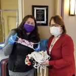 women holding masks