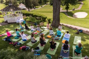 women doing yoga at a golf course