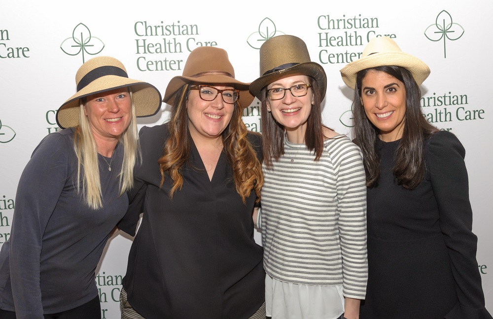 group photo of women wearing hats